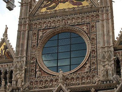 锡耶纳Duomo外墙拱廊教会大理石艺术窗饰耳堂门户网站玻璃窗半月形彩色图片