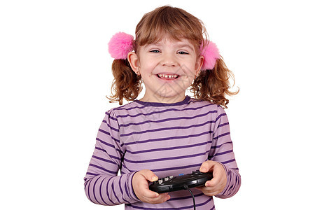 快乐的小女孩玩白色电子游戏图片