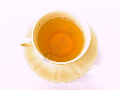 一杯茶 用白色背景隔绝的花粉形态玻璃时间饮料草本盘子棕色花朵液体早餐杯子图片