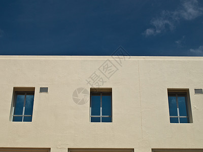 蓝色天空办公大楼的表面窗面建筑公司房子中心窗户玻璃城市商业建筑学办公室图片