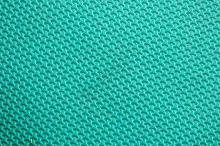 绿色橡胶垫子的色质和型状橡皮地面墙纸小地毯房子鞋垫编织风格地板宏观图片