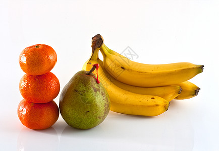 德卡纳梨 橘子和香蕉叶柄食物情调奇异果蔬菜果汁饥饿时间早餐精力图片