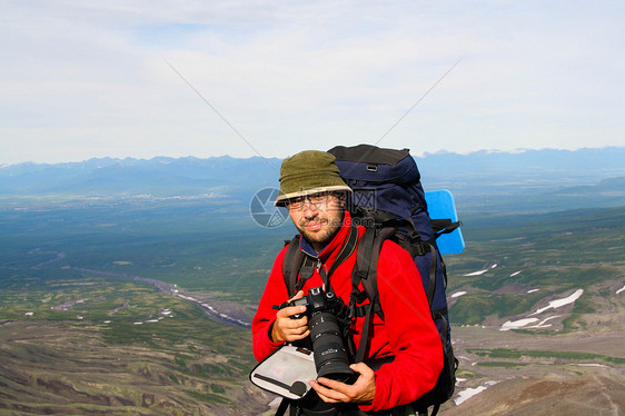 卡姆恰特卡风速摄影师闲暇旅行游客丘陵山脉娱乐背包相机顶峰摄影图片