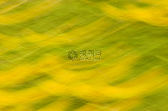 绿色和黄色运动模糊的抽象纹理水平速度半圆形图片