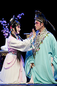 美丽的中国传统歌剧女演员 穿着戏剧服装的戏服头饰遗产女孩戏装戏剧性风俗男人艺术男性女士图片
