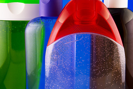 装在彩色背景的化妆品容器上身体香水管子绿色清洁剂液体卫生空白蓝色团体图片