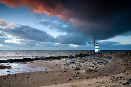 日落时北海的灯塔旅行海岸蓝色戏剧性传统天空支撑地平线太阳文化图片