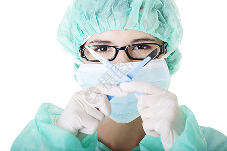 持有手术刀的女医生或护士职业专家工作药品面具保健诊所外科女性蓝色图片