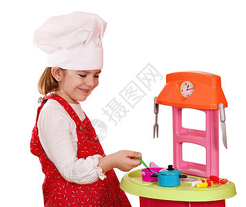快乐的小女孩在做饭图片