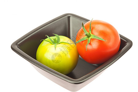 碗里的绿色和红色西红柿被白色隔开宏观食物钥匙水平剪裁蔬菜用具小路阴影菜肴图片