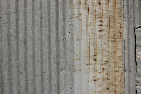 一条生锈的铁铁铁栅栏特写锌墙金属拉丝平铺技术插图瓷砖机库商业墙纸橙子图片