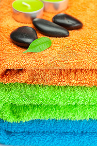 三条多色浴巾 黑色SPA STO的背景背景生活叶子福利温泉奢华收藏塑料场景石头卫生图片