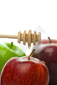 粘贴在白色上孤立的蜂蜜和苹果黄色金子早餐食物蜜蜂液体糖浆木头酱料水果图片