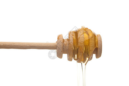 白色时与粘贴蜂蜜隔开花絮木头文化糖浆酱料食物钢包勺子棕色黄色图片