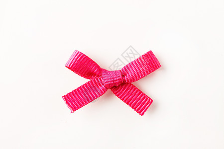 粉红礼弓丝带念日粉色纺织品礼物展示背景图片