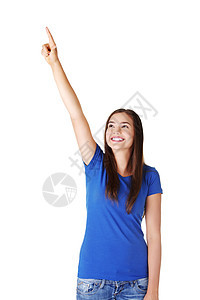 兴奋的年轻女性指着复制空间商业女孩成人手臂情绪化黑发白色广告女士快乐图片