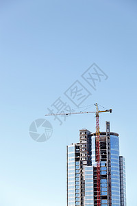 正在建造的高楼水泥建筑学工程巨石商业天空起重机纪念碑框架蓝色图片