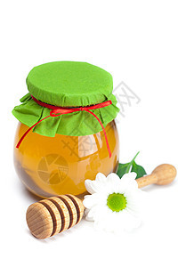 紧紧粘在白色上隔着的蜂蜜 花和罐子甜点养分香味糖浆玻璃洋甘菊薄雾早餐生活植物图片