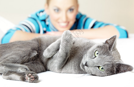 猫和女人动物脊椎动物晶须闲暇眼睛哺乳动物友谊女士乐趣猫科动物图片