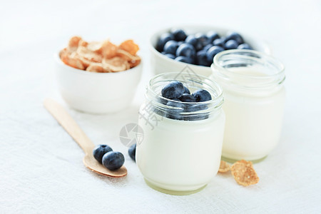 健康早餐营养奶油勺子活力酸奶茶点燕麦乳白色玻璃谷物图片