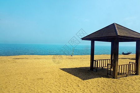 海沙滩临时背景图像海洋旅行太阳蓝色冲浪雨伞热带渔船天空排球图片