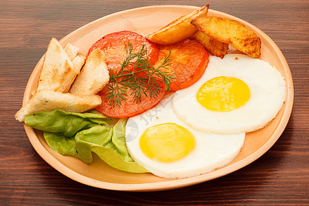 带蔬菜的炒鸡蛋橙子营养食物土豆草本植物面包油炸早餐美食午餐图片