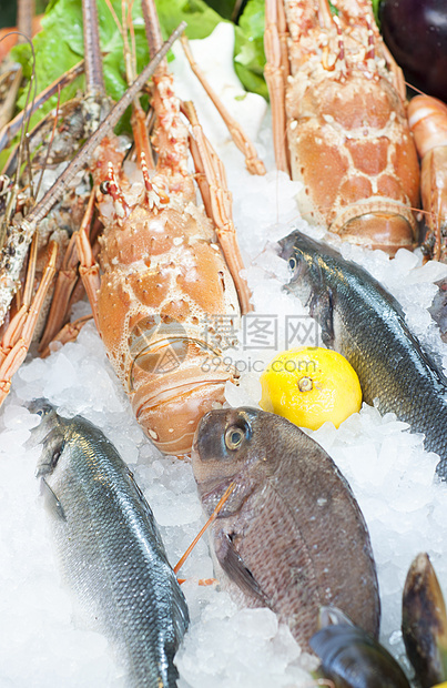 新鲜海鲜海洋章鱼食物盘子市场饮食柠檬乌贼营养香葱图片