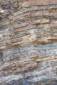 高陡峭海岸岩层岩石水平地球分层砂岩沉积侵蚀碎石卵石石头时间图片