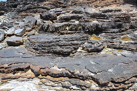高陡峭海岸岩层岩石水平地质碎石侵蚀地球分层编队石头沉积时间图片