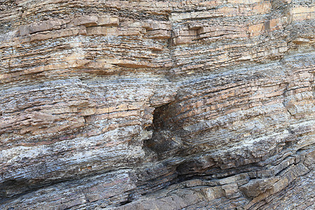 高陡峭海岸岩层岩石地质水平地层碎石砂岩时间卵石分层石头沉积图片