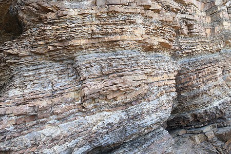 高陡峭海岸岩层岩石砂岩地质编队石头地球水平分层碎石卵石地层图片