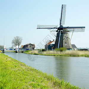 荷兰Akersloot附近的风车位置运河建筑学外观世界旅行图片