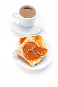 茶和吐司加焦糖 白的孤立桌子早餐面包陶瓷饮料飞碟牛奶杯子食物制品图片