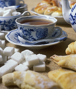 带有糕点的茶杯茶匙美食小吃静物膳食营养诱惑食物饮料汽水图片