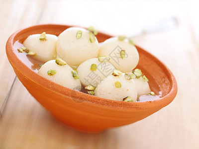 印度里拉丘拉甜点食物水平垃圾芝士奶制品糖浆背景图片