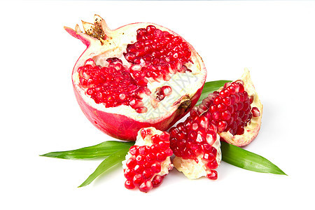 石榴种子红色食物热带水果萼片叶子白色异国情调图片