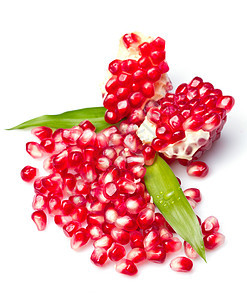石榴假种皮白色异国食物水果绿色叶子种子萼片红色图片