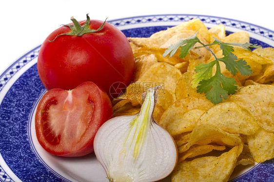 黄黄土薯芯片盐渍垃圾饮食土豆小吃午餐白色食物宏观卷曲图片