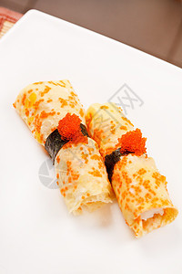 奥梅莱特 Maki 寿司奶油海鲜鳗鱼玉子午餐美味宏观芝麻飞花食物背景图片