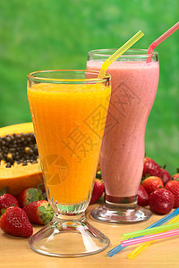 木瓜果汁和草莓奶昔稻草茶点黄色照片玻璃食物橙子水果饮料健康图片