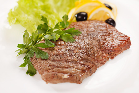 牛肉牛排鱼片产品草药炙烤牛肉烹饪饮食柠檬蔬菜食物图片