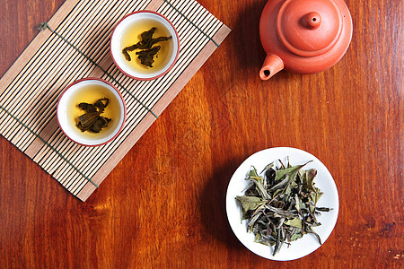 中国茶饮料液体陶器金子杯子厨房宏观文化仪式竹子图片