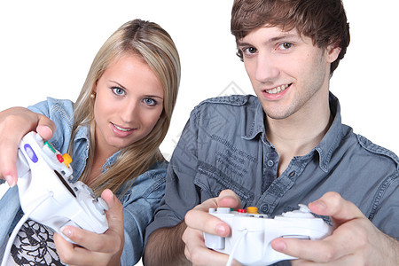 玩电脑游戏的人控制器玩具技术玩家夫妻童年闲暇电脑享受女孩图片