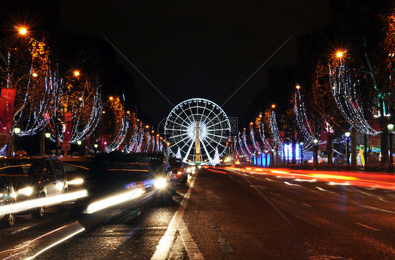 圣诞时亮明的香普伊利赛大道国家街道大街旅游交通运动车轮正方形花环冠军图片