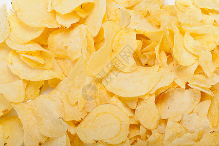 白背景孤立的土豆薯片小吃饮食白色食物黄色饼干波纹油炸宏观美食图片