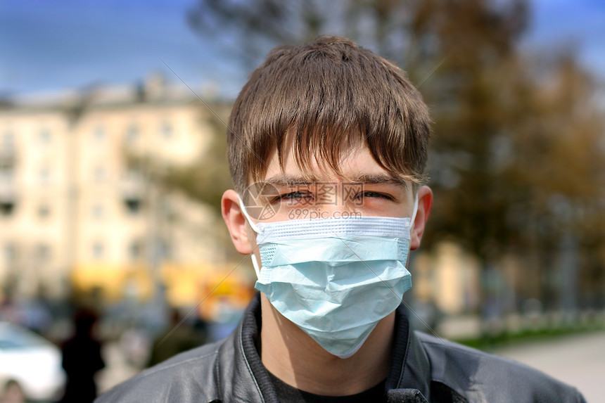 戴流感面具的青少年市民护理防御治疗疾病街道瘟疫青年面部城市图片
