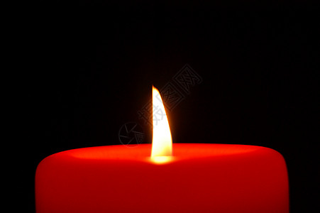红蜡烛黄色硬脂温暖黑色纪念红色宏观火焰橙子背景图片