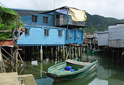 Taa O渔村棚户区天空钓鱼木头风化场景村庄窝棚住宅蓝色图片