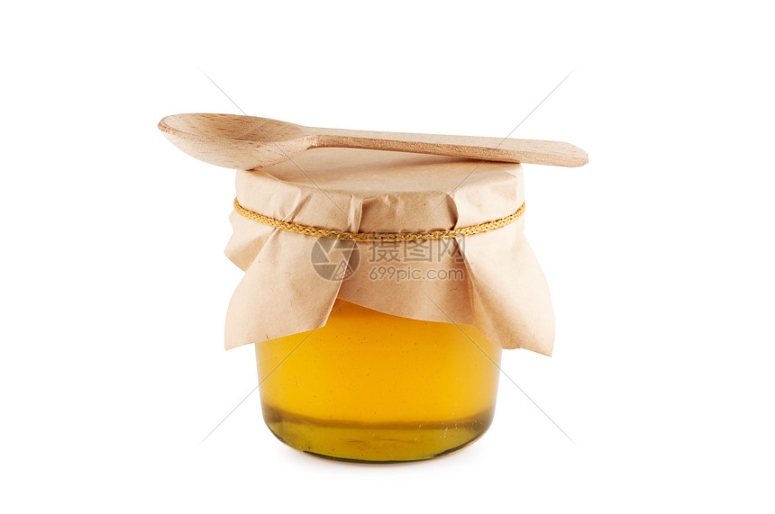 蜂蜜在罐木勺分离图片