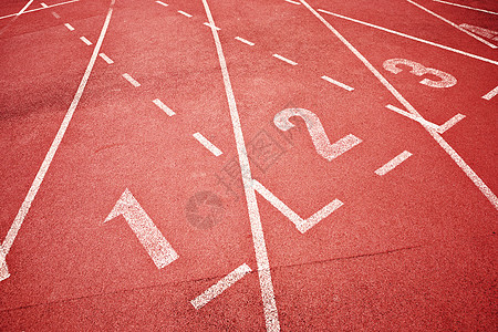 运动员的赛跑轨道竞争训练跑步速度椭圆形地面白色体育场竞技运动图片